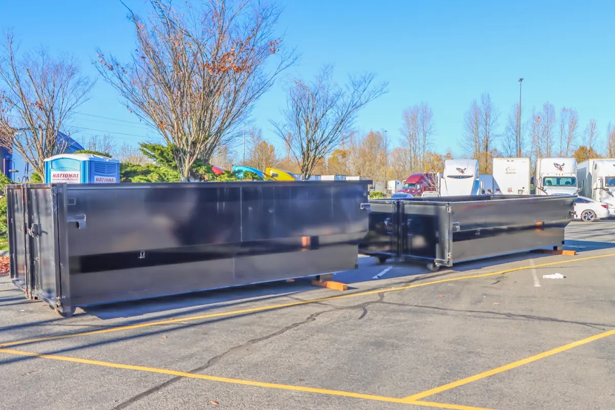 Professional dumpster rental service with roll-off container on residential driveway in Nevada